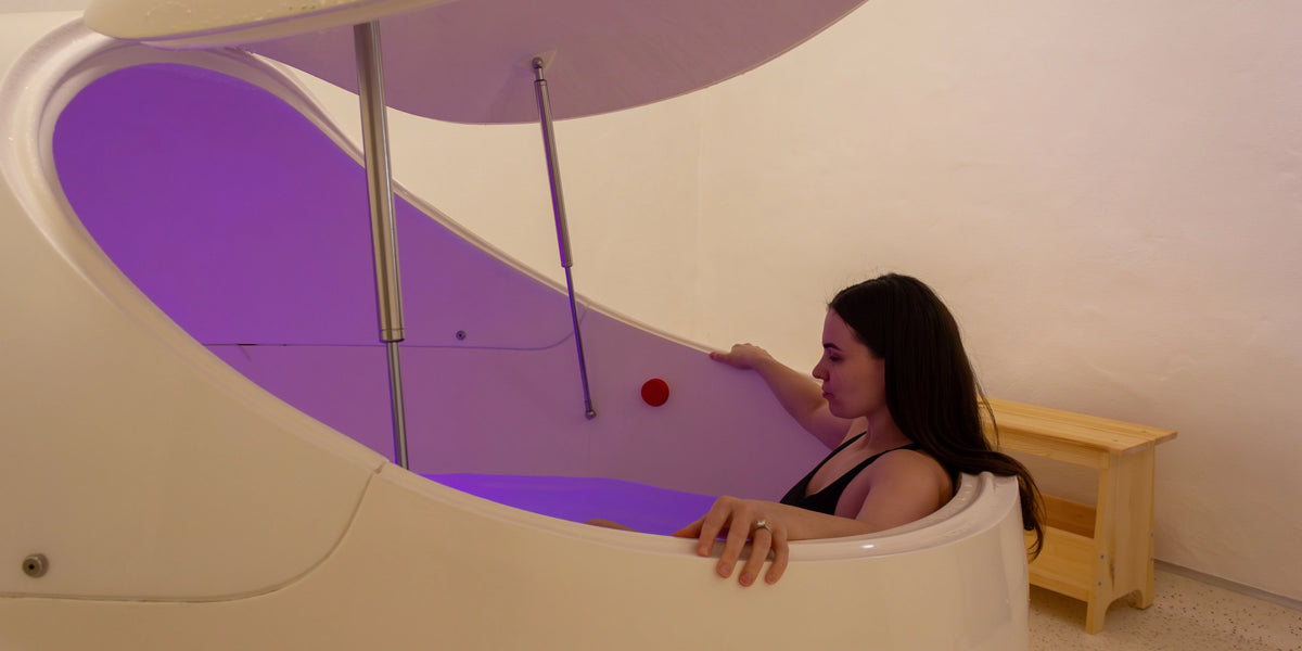 Woman relaxing in a private float therapy pod at Clear Mind Studio in Perth