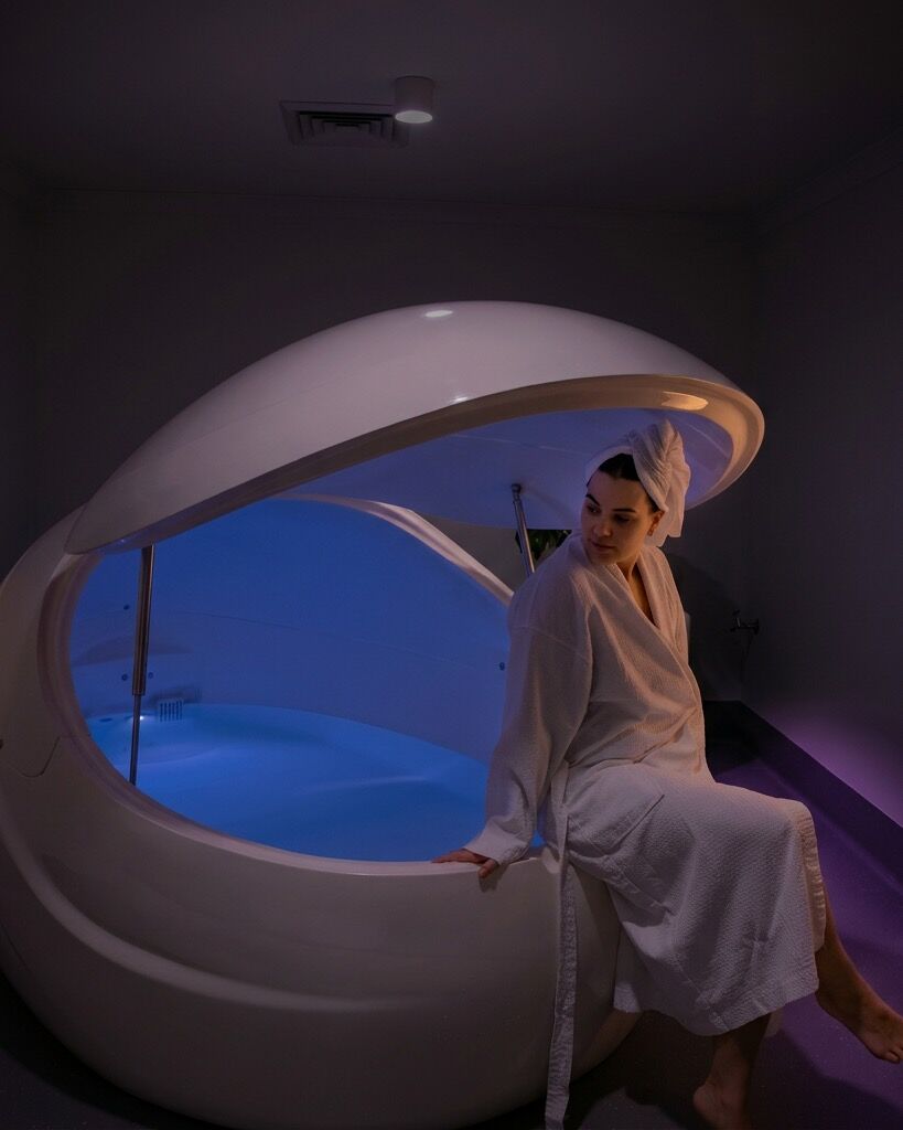 A softly lit private float room at Clear Mind Studio
