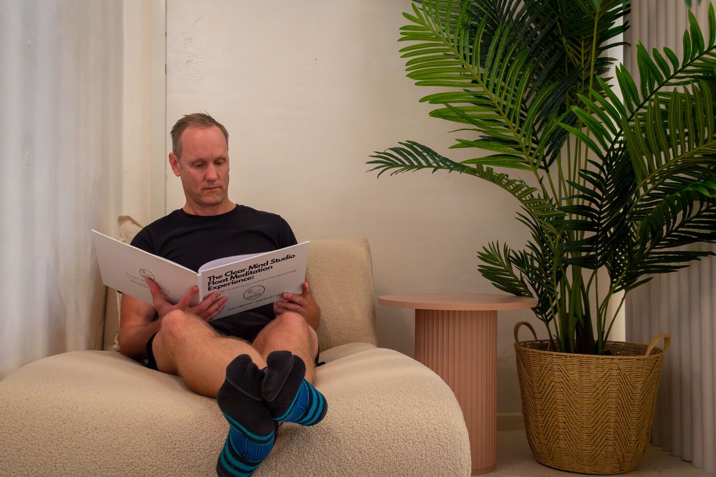 A business owner taking an unhurried moment to rest at Clear Mind Studio