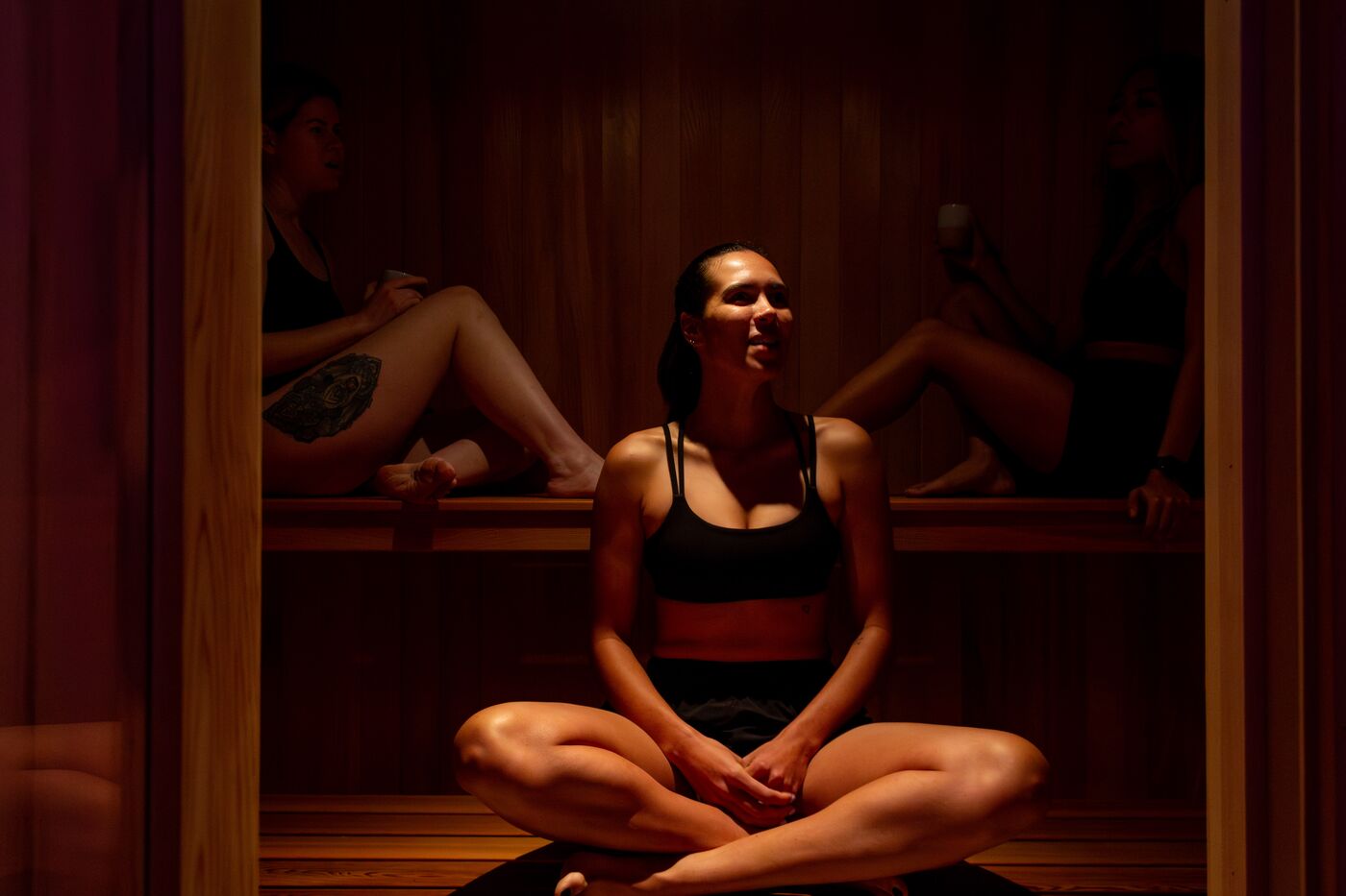 Guests relaxing together in the sauna at Clear Mind Studio